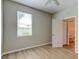 Bright bedroom featuring a ceiling fan, window with blinds, and access to the bathroom at 1862 Lorenzo Ln, Oviedo, FL 32765