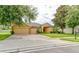 Charming single-Gathering home featuring a manicured front yard, brick driveway, and a spacious three-car garage at 1862 Lorenzo Ln, Oviedo, FL 32765