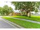 Charming home exterior with a manicured front lawn and mature trees at 1862 Lorenzo Ln, Oviedo, FL 32765