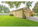 Exterior view of home with a two-car garage and manicured lawn at 1862 Lorenzo Ln, Oviedo, FL 32765