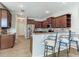 Modern kitchen with stainless steel appliances, granite countertops and bar seating at 1862 Lorenzo Ln, Oviedo, FL 32765