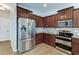 Well-equipped kitchen features stainless steel appliances and sleek cabinetry at 1862 Lorenzo Ln, Oviedo, FL 32765
