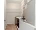Laundry room with tile flooring, wire shelving, and a washing machine at 1862 Lorenzo Ln, Oviedo, FL 32765
