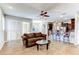 Open-concept living room with tile floors, great lighting, and modern decor at 1862 Lorenzo Ln, Oviedo, FL 32765