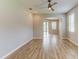 Spacious living area with wood floors and access to the lanai and pool at 1862 Lorenzo Ln, Oviedo, FL 32765