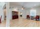 Inviting living room featuring hardwood floors, a ceiling fan, and a display cabinet at 1862 Lorenzo Ln, Oviedo, FL 32765