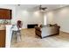 Open-concept living area boasts tile flooring, ceiling fan, and neutral colors at 1862 Lorenzo Ln, Oviedo, FL 32765