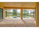 Covered patio featuring brick flooring, a ceiling, and a view of the pool at 1862 Lorenzo Ln, Oviedo, FL 32765