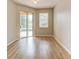 Bright room with wood floors, sliding door to the lanai, and ample light at 1862 Lorenzo Ln, Oviedo, FL 32765