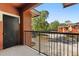 Balcony with a metal railing, trees, and community views at 191 Villa Di Este Ter # 201, Lake Mary, FL 32746