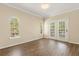 Bedroom with arched windows, a french door, and hardwood floors at 191 Villa Di Este Ter # 201, Lake Mary, FL 32746