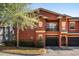Inviting exterior of a two-story townhome featuring a one-car garage and landscaping at 191 Villa Di Este Ter # 201, Lake Mary, FL 32746