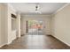 Light-filled living room with hard surface floors and access to the outdoor patio at 191 Villa Di Este Ter # 201, Lake Mary, FL 32746