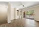 Bright living room with wood floors, neutral walls, built-in shelving, and sliding glass doors at 191 Villa Di Este Ter # 201, Lake Mary, FL 32746