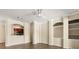 Open-concept living room with a ceiling fan and views into the kitchen at 191 Villa Di Este Ter # 201, Lake Mary, FL 32746