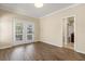Living room with hardwood floors, a french door, and access to a bathroom at 191 Villa Di Este Ter # 201, Lake Mary, FL 32746