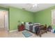Cozy bedroom featuring neutral walls, tile floors, and a simple single bed frame at 1910 Palm View Dr, Apopka, FL 32712