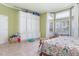 Large primary bedroom featuring a built in dresser and storage, with tile floors at 1910 Palm View Dr, Apopka, FL 32712
