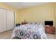 Bedroom featuring tile floors, a large window, and closet at 1910 Palm View Dr, Apopka, FL 32712
