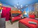 The themed bedroom features a bunk bed, a queen bed, and brick-design wall paneling at 1999 Tropical Palms Cir, Kissimmee, FL 34747