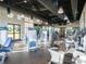 Bright gym featuring updated equipment, a rubber floor, and several pendant lights at 1999 Tropical Palms Cir, Kissimmee, FL 34747