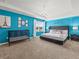 The main bedroom features a tray ceiling, a crib, and plenty of natural light at 1999 Tropical Palms Cir, Kissimmee, FL 34747