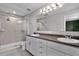 Bathroom with a glass shower door, double sink vanity, and recessed lighting at 228 Primrose Dr, Davenport, FL 33837