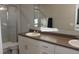 Bathroom with double sinks and a walk-in shower at 228 Primrose Dr, Davenport, FL 33837