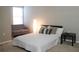 Comfortable bedroom with bed and couch near a bright window at 228 Primrose Dr, Davenport, FL 33837
