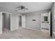 Bedroom with neutral carpet, ensuite bathroom, and walk-in closet at 228 Primrose Dr, Davenport, FL 33837