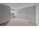 Neutral bedroom with plush carpet, gray walls, and bright window views at 228 Primrose Dr, Davenport, FL 33837