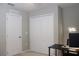Bedroom featuring closet, door, desk and neon sign at 228 Primrose Dr, Davenport, FL 33837