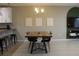 Well-lit dining room with modern furnishings, perfect for Gathering meals at 228 Primrose Dr, Davenport, FL 33837