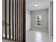 Bright foyer with tile flooring, coat rack, and staircase at 228 Primrose Dr, Davenport, FL 33837