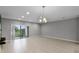 Bright living room featuring tile floors and sliding glass doors to the outside at 228 Primrose Dr, Davenport, FL 33837