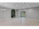 Spacious living room with tile flooring and sliding glass door to patio at 228 Primrose Dr, Davenport, FL 33837