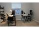 Office space featuring a window, chairs, desks and shelves at 228 Primrose Dr, Davenport, FL 33837