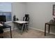 Office space featuring a window, chairs, desks and shelves at 228 Primrose Dr, Davenport, FL 33837