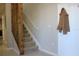 Carpeted staircase with wooden accents, leading to the upper level of the home at 228 Primrose Dr, Davenport, FL 33837