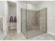 This primary bathroom features a frameless glass shower with a built in seat and niche at 2342 Clemblue Rd, Clermont, FL 34715