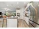 Bright kitchen features stainless steel appliances, granite countertops, ample cabinet space, and stylish island at 2342 Clemblue Rd, Clermont, FL 34715