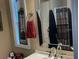 Bathroom with decorative window, faucet, vanity, and towel ring at 2808 Manatee Rd, Tavares, FL 32778