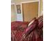 A well-decorated bedroom with a closet and coordinated bedding, creating a comfortable retreat at 2808 Manatee Rd, Tavares, FL 32778