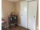 Neutral bedroom with a built-in wardrobe featuring sliding doors, providing ample storage space at 2808 Manatee Rd, Tavares, FL 32778