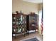 Elegant dining room showcasing antique china cabinets filled with decorative dishware and ornate furniture at 2808 Manatee Rd, Tavares, FL 32778