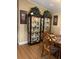 Dining room featuring two china cabinets with dishware and greenery at 2808 Manatee Rd, Tavares, FL 32778