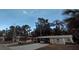 Cozy one-story home featuring a covered carport and a well-maintained front yard at 2808 Manatee Rd, Tavares, FL 32778