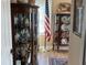 Elegant living area with display cabinets and view of an American flag at 2808 Manatee Rd, Tavares, FL 32778