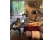 Cozy living area with sliding doors to deck, decorative lamps, and floral sofa at 2808 Manatee Rd, Tavares, FL 32778