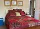 Bright main bedroom featuring stylish decor, including framed artwork and coordinated bedding at 2808 Manatee Rd, Tavares, FL 32778